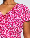 A woman wearing a Estelle's Grapa Floral Dress.