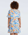 The back view of a woman wearing a blue and orange Estelle Gazania Dress.