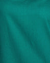 A close up image of a Estelle Shadow Dress, teal colored fabric.