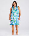 A woman wearing a blue and green floral print Travola Dress by Estelle.