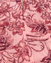 A close up of a pink floral printed Estelle Sophia Halter Dress.