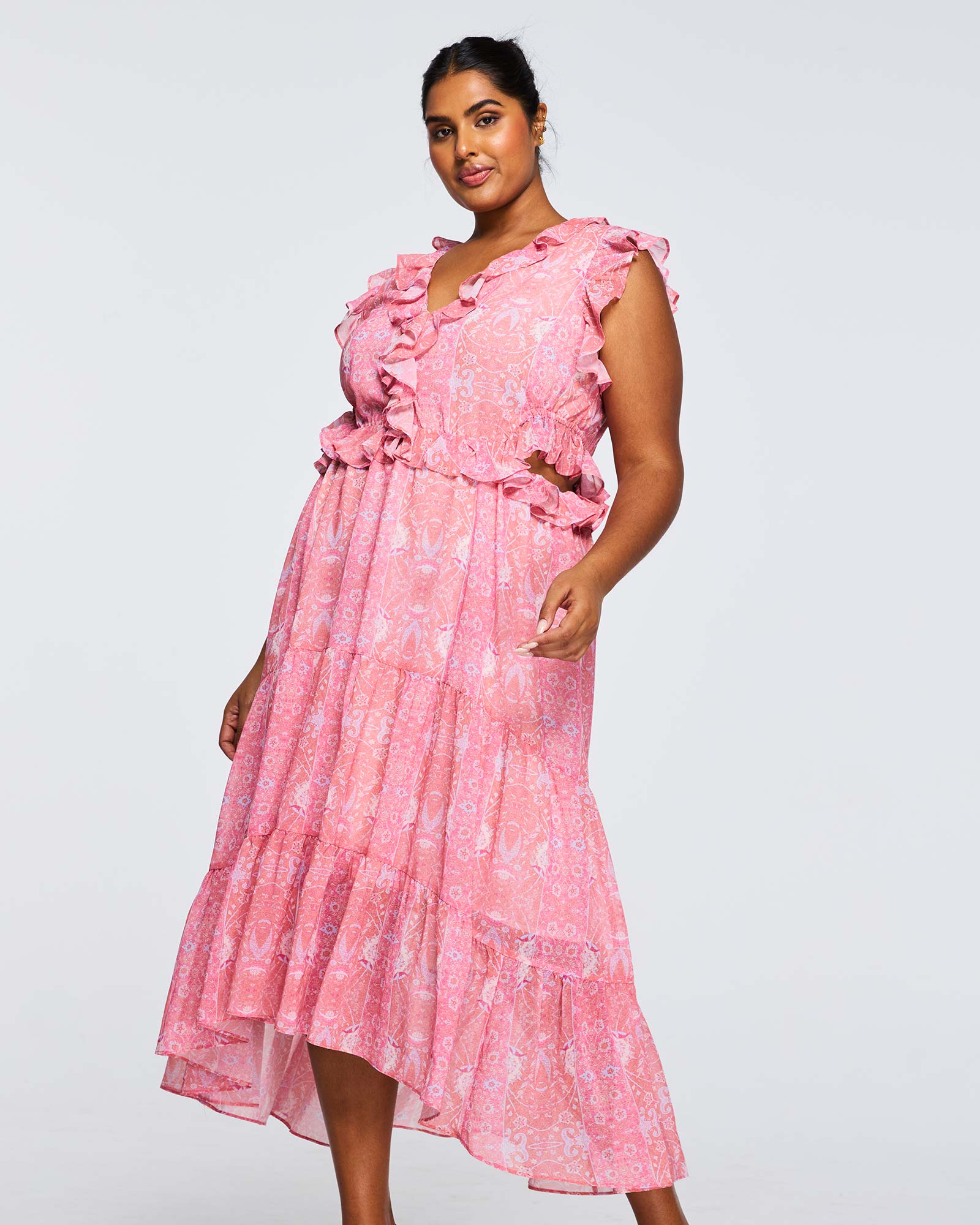 A plus size woman wearing a Estelle Fiorentina Frill Dress.