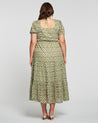 The back view of a woman in an Estelle Olive Heart Maxi Dress.