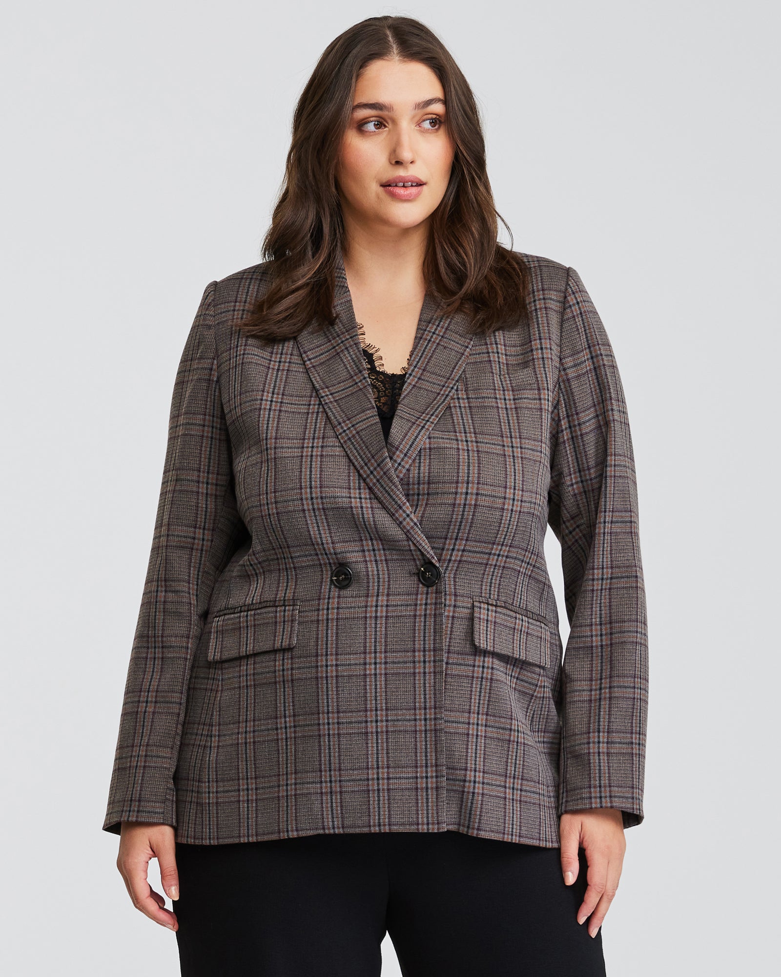 A plus-sized woman wearing a Lilibet Brown Check Double-Breasted Blazer.