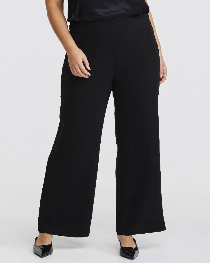 A plus-size woman wearing Nightlife Black Wide-Leg Pant.