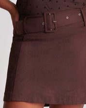 Brown skirt with a belt on a plain background