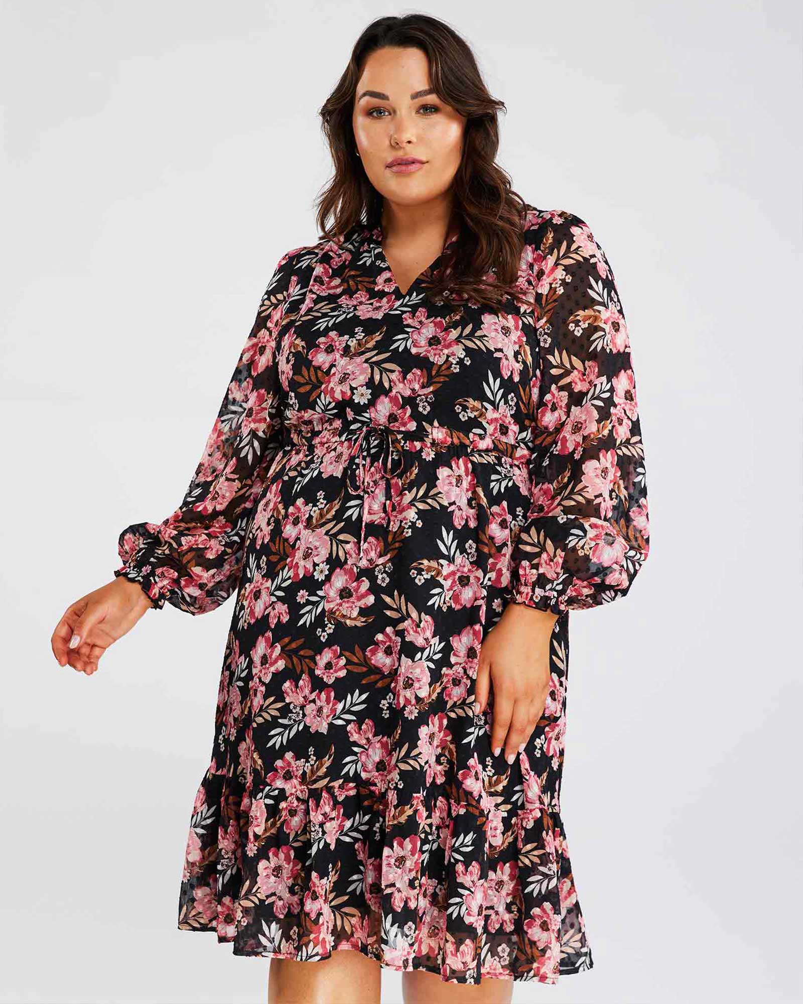 A Woodland Floral plus size woman wearing a Woodland Floral Textured Mini Dress.