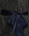 Close up of Shimmery Black and Gold fabric and satin belt on the Gloria Belted halter Dress by Estelle womens clothing