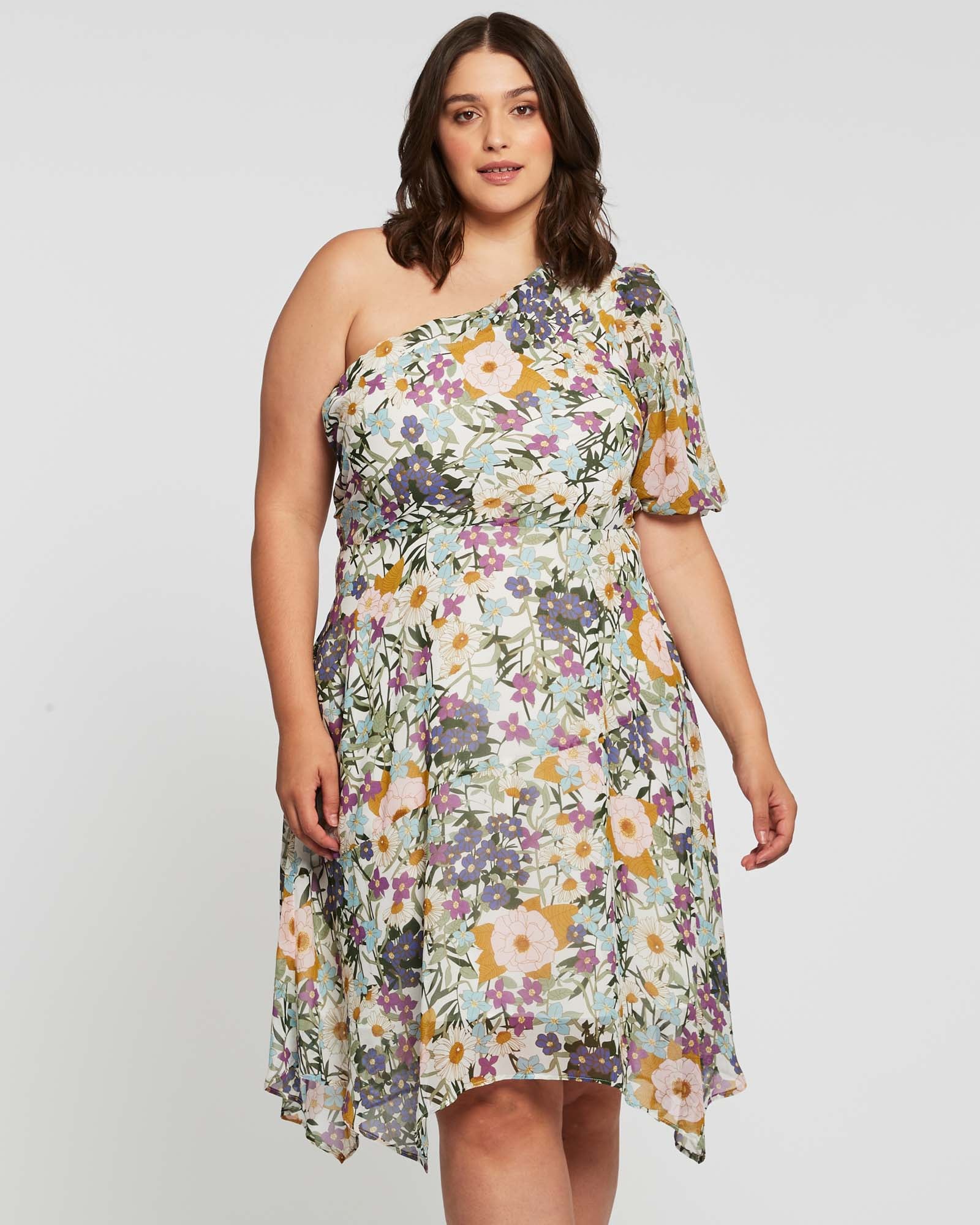 A plus size woman wearing the Estelle Wildbloom Midi Dress.