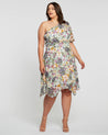 A plus size woman wearing the Estelle Wildbloom Midi Dress.