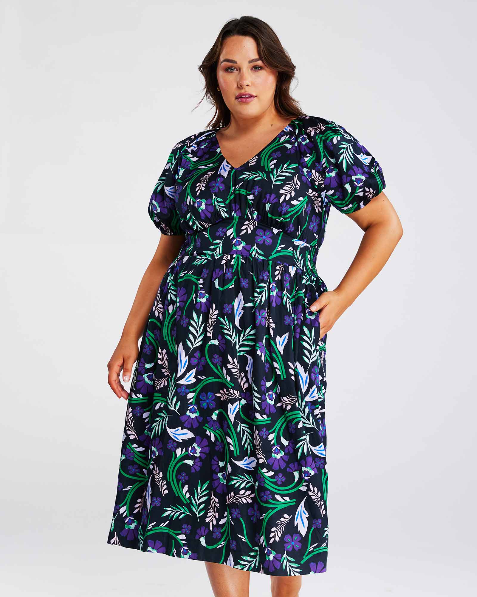A plus size fashionista wearing the Ultraviolet Cotton Floral Midi Dress.
