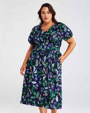 A plus size fashionista wearing the Ultraviolet Cotton Floral Midi Dress.