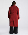 The back view of a woman wearing a Georgie Trench Coat- Ginger by Estelle.