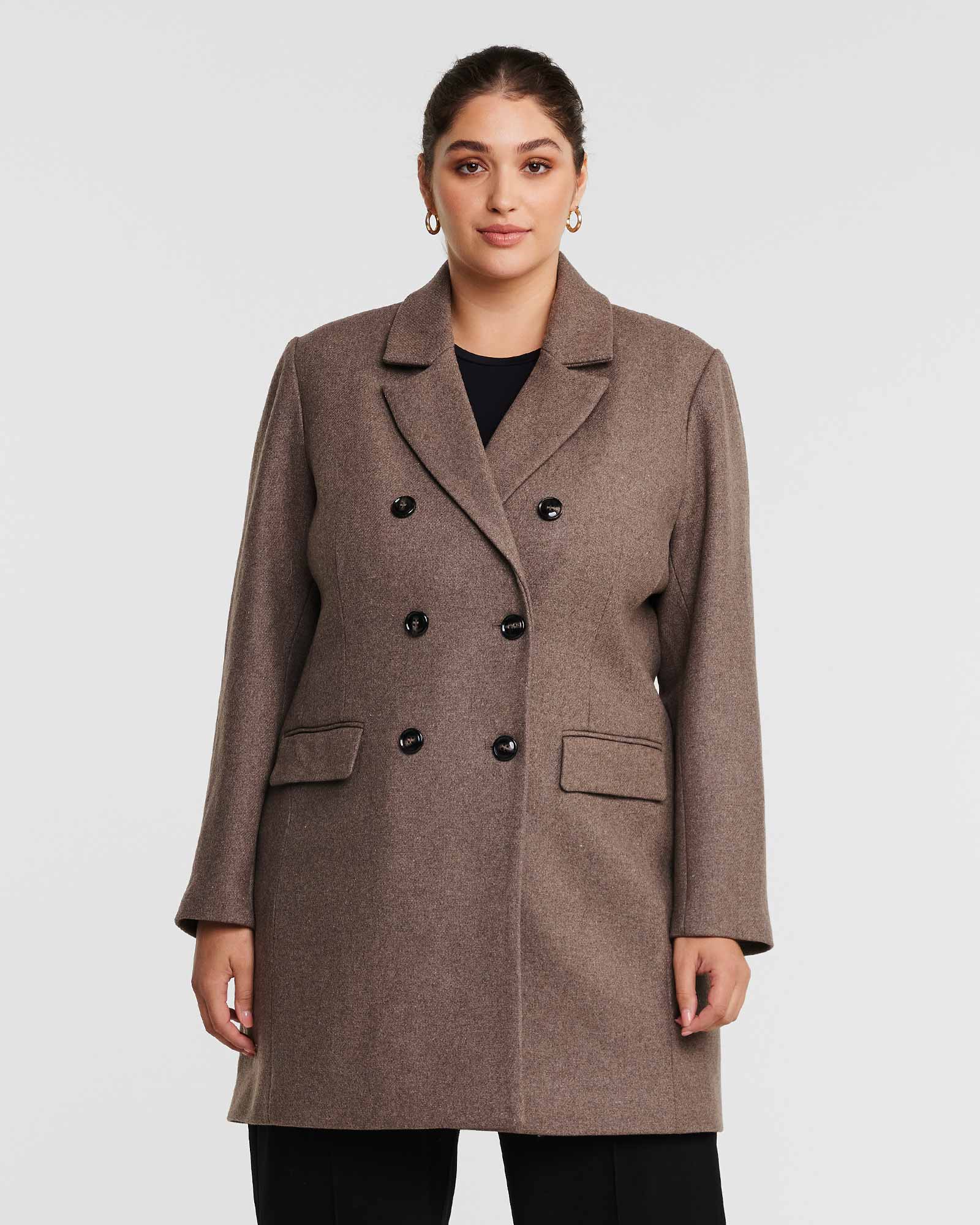 A fully lined plus-size woman wearing the Redford Mocha Brown Double-Breasted Coat.