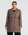 A fully lined plus-size woman wearing the Redford Mocha Brown Double-Breasted Coat.