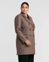 A plus-size woman wearing a Redford Mocha Brown Double-Breasted Coat.