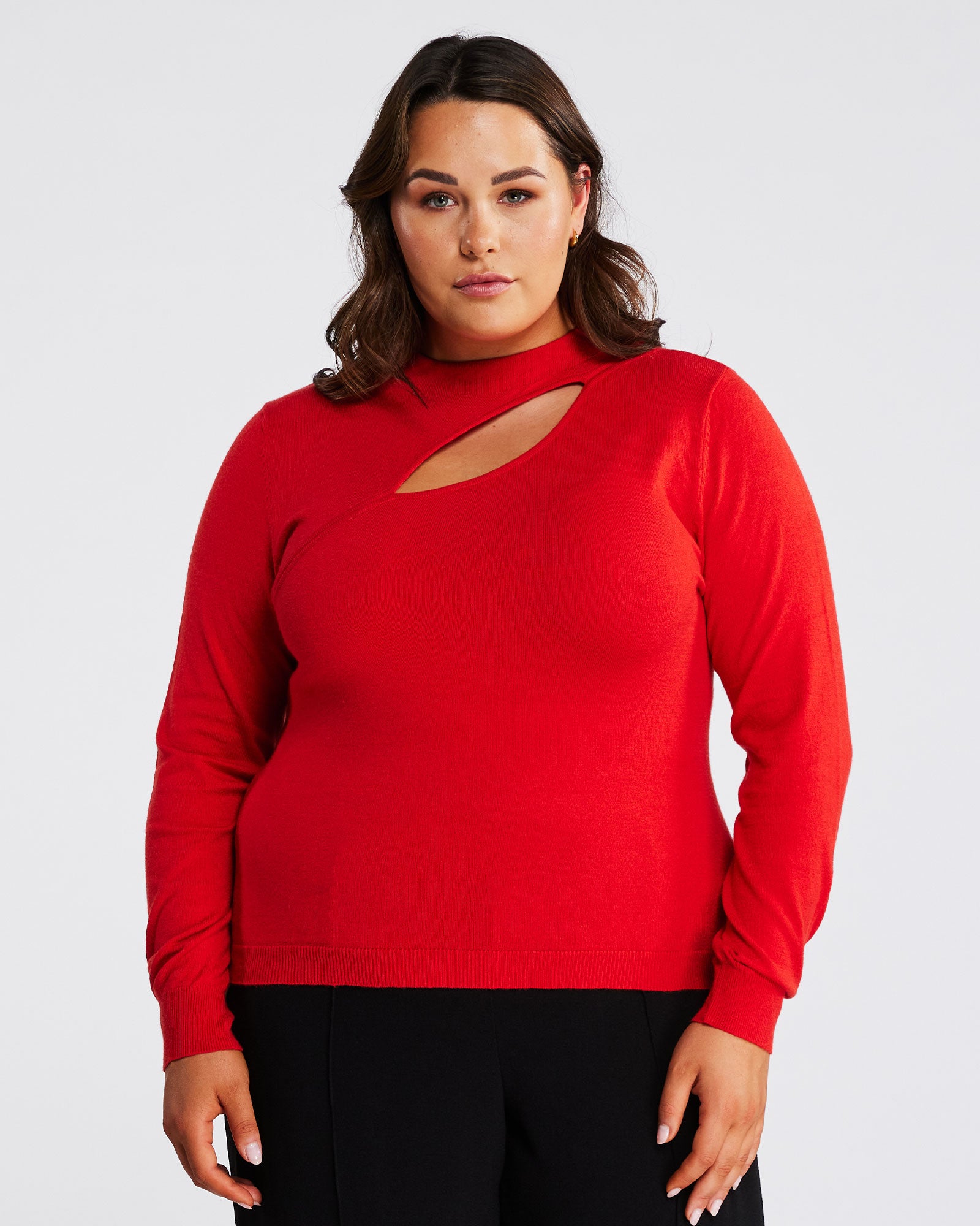 A woman in an Orange Cut Out Crewneck Sweater.