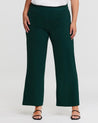 An Estelle plus size woman wearing Nightlife Green Wide Leg Pants.