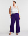 A woman wearing the Nightlife Purple Wide Leg Pant.